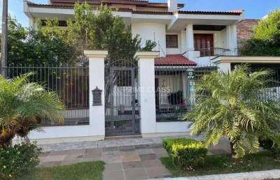 Casa com 5 quartos à venda na rua irmão agnelo chaves, 170, marechal rondon, canoas por r$ 1.730.000