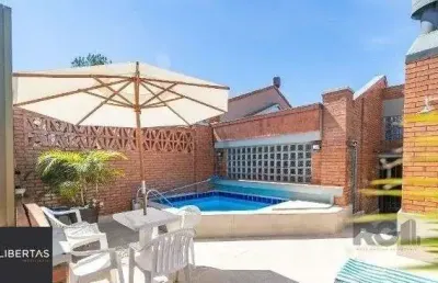 Casa em condomínio fechado com 3 quartos à venda na Avenida Jacuí, 978, Cristal, Porto Alegre