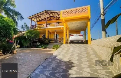Casa de 4 dormitórios,  no bairro lomba do pinheiro