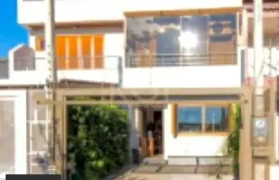 Casa com 3 quartos à venda na Rua Waldemar da Silva Tavares, 234, Guarujá, Porto Alegre