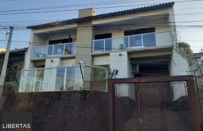 Casa com 3 quartos à venda na Rua Eurico Lara, 505, Medianeira, Porto Alegre