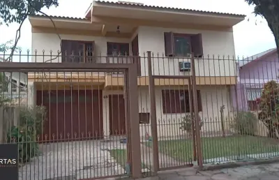 Casa com 3 quartos à venda na Avenida Cruz Alta, 416, Nonoai, Porto Alegre