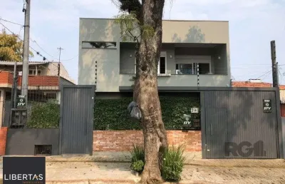 Casa com 4 quartos à venda na Rua Menezes Paredes, 290, Nonoai, Porto Alegre