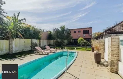Casa com 3 quartos à venda na Rua Humberto de Campos, 1267, Partenon, Porto Alegre