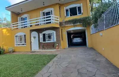 Casa com 4 quartos à venda na Rua Buttenbender,56, --, Fátima, Canoas