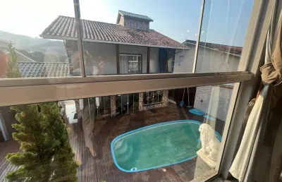 Casa com 4 quartos à venda em fundos, biguaçu  por r$ 960.000