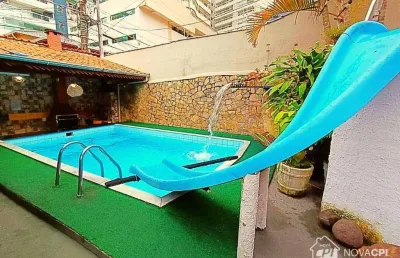 Sobrado com 4 quartos canto do forte em praia grande/sp