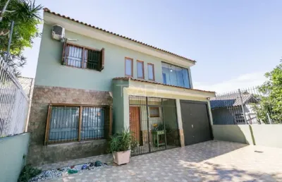 Casa com 3 quartos à venda na rua dário totta, 2114, camaquã, porto alegre por r$ 1.350.000