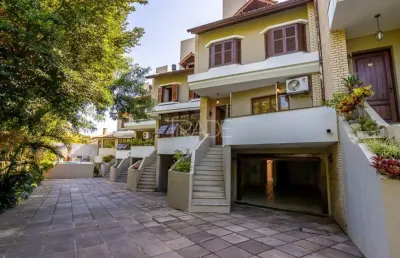 Casa em condomínio fechado com 4 quartos à venda na rua padre joão batista reus, 438, tristeza, porto alegre por r$ 1.490.000