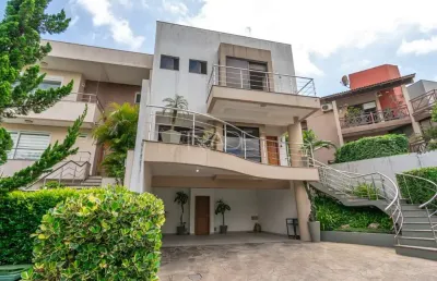 Casa em condomínio fechado com 3 quartos à venda na avenida edgar pires de castro, 540, hípica, porto alegre por r$ 1.150.000