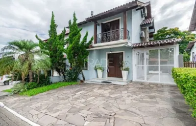 Casa em condomínio fechado com 3 quartos à venda na avenida edgar pires de castro, 540, hípica, porto alegre por r$ 895.000