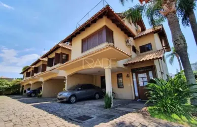 Casa em condomínio fechado com 3 quartos à venda na rua vicente failace, 252, tristeza, porto alegre por r$ 1.400.000
