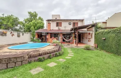 Casa com 3 quartos à venda na avenida guarujá, 140, guarujá, porto alegre por r$ 750.000