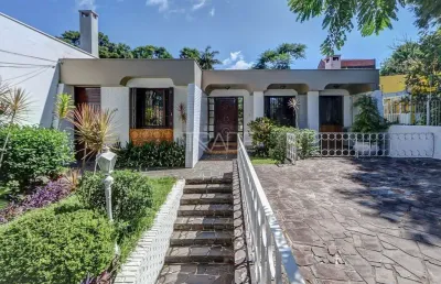 Casa com 4 quartos à venda na avenida pereira passos, 796, vila assunção, porto alegre por r$ 1.200.000