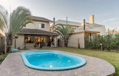 Casa em condomínio fechado com 3 quartos à venda na avenida juca batista, 8000, belém novo, porto alegre por r$ 1.280.000