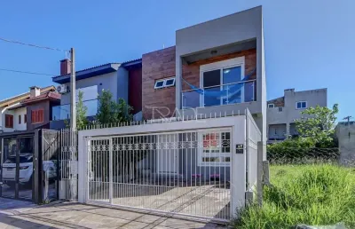 Casa com 3 quartos à venda na rua aldo sani, 143, hípica, porto alegre por r$ 699.000
