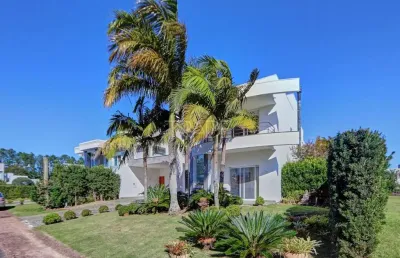 Casa em condomínio fechado com 4 quartos à venda na avenida juca batista, 8000, belém novo, porto alegre por r$ 2.700.000