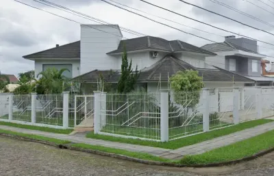 Casa de 385 m², com 04 dormitórios (sendo um deles uma suíte), para venda