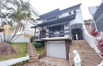 Casa com 5 dormitórios para alugar, 382 m² por r$ 7.000,00/mês - tristeza - port