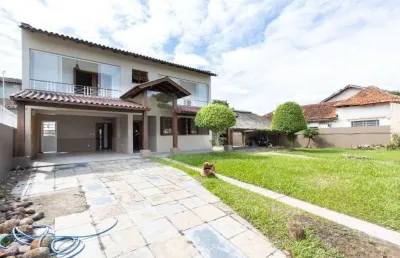 Casa de 4 dormitórios com piscina para locação no bairro guarujá