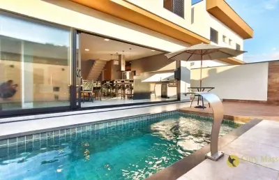 Mobiliada e moderna! magnífico sobrado com 220m², piscina, 3 suítes e parcialmente mobiliado, à venda por r$1.769.900 - cond. central parque -salto/sp