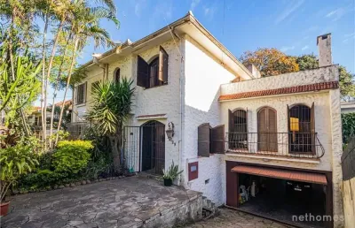 Casa com 5 quartos à venda na rua professor ivo corseuil, 129, petrópolis, porto alegre, 400 m2 por r$ 1.350.000