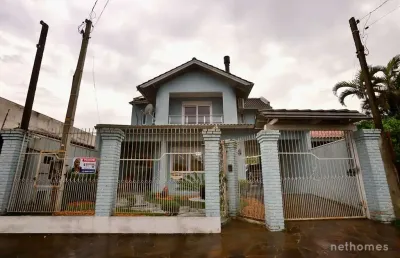 Casa com 4 quartos à venda na rua vereador lauro barcellos, 104, bela vista, alvorada, 320 m2 por r$ 949.900