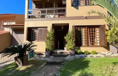 Casa com 4 quartos à venda na rua ari peixoto martins, 190, espírito santo, porto alegre, 262 m2 por r$ 838.000
