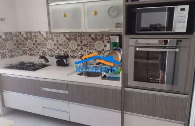 Apartamento de 91m² com 3 dormitórios, suíte e 2 vagas de garagem.