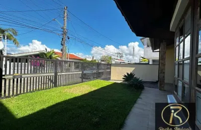 Excelente casa 3 dormitórios sendo 1 suíte com amplo espaço sala pé direto alto dois ambiente casa um show 150 mts da praia r$ 650.000.00