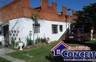 C27 - residência localizada em região de moradores no balneário presidente