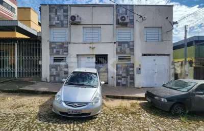 Terreno à venda de 300m² no bairro planalto com galpão e 2 sobrados de fundo.