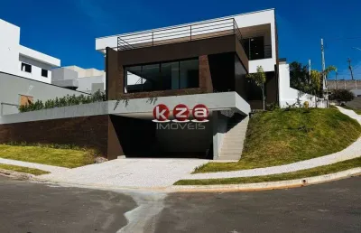 Casa de alto padrão a venda no condomínio tabapuã, valinhos-sp: 3 suítes, 3 salas, 5 banheiros e 4 vagas e amplo gourmet.