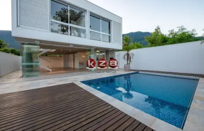 Imóvel de luxo à venda em são sebastião-sp: casa na praia de guaecá com 4 suítes, 3 salas, amplo gourmet e piscina, ao lado do mar.