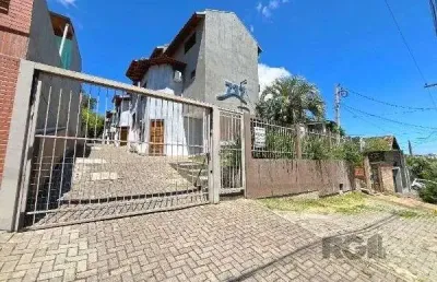 Casa em condomínio fechado com 3 quartos à venda na Rua Costa Lima, 810, Nonoai, Porto Alegre