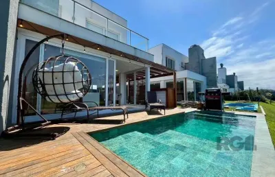 Casa em condomínio fechado com 4 quartos à venda na Avenida Jaçanã, 1185, Atlântida, Xangri-Lá