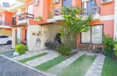 Linda casa com 3 dormitórios, sendo 1 suíte, sala ampla no condomínio de ótima localização