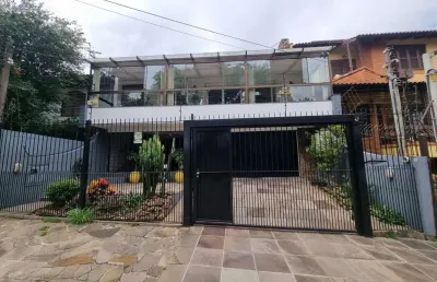 Casa com 3 quartos à venda na Rua Canto e Melo, 126, Nonoai, Porto Alegre