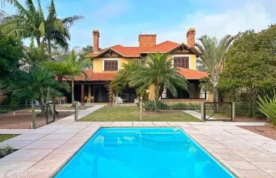 Terra ville - casa com 384 m² - fundo para o lago , semi mobiliada , com 3 suites e piscina .