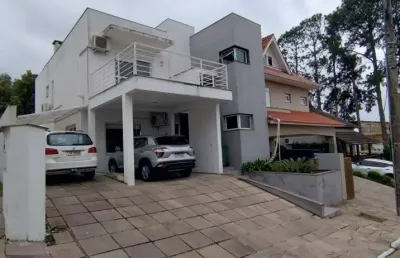 Casa em condomínio fechado com 3 quartos à venda na Avenida Edgar Pires de Castro, 616, Hípica, Porto Alegre