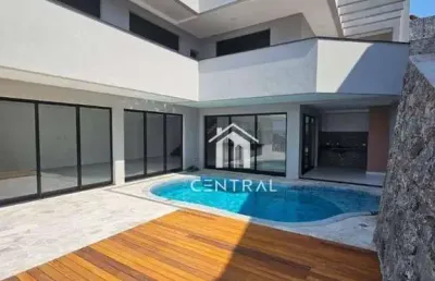 Casa em condomínio de alto padrão à venda, com 3 dormitórios sendo 3 suítes, área gourmet com piscina e cozinha, 6 vagas de garagem!