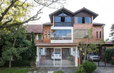 Casa com 3 quartos à venda na Rua Ponciano Pacheco da Silveira, 114, Guarujá, Porto Alegre