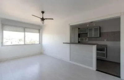 Apartamento semimobiliado à venda no bairro cristal, 2 dormitórios, 2 banheiros, 1 vaga coberta e vista livre para o guaíba