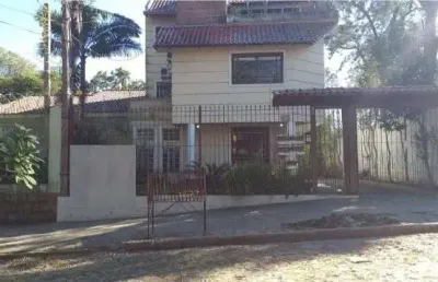 Casa em condomínio fechado com 4 quartos à venda na Rua Upamaroti, 1129, Cristal, Porto Alegre