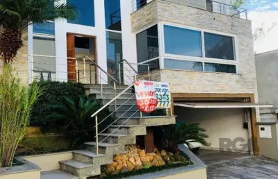 Casa em condomínio fechado com 3 quartos à venda na Rua Tocantins, 540, Lomba do Pinheiro, Porto Alegre