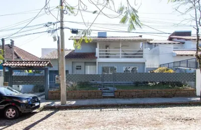 Casa 3 dormitórios no bairro tristeza com 2 vagas de garagem