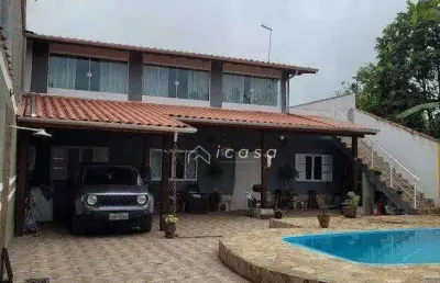 Casa com 4 dormitórios à venda, 247 m² por r$ 986.000,00 - porto novo - caraguatatuba/sp