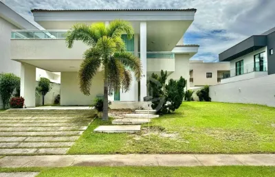 Belíssima casa com estilo americano, elevador, 04 belas suítes e espaço para cinema/brinquedoteca.