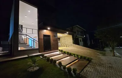 Casa terrea imponente com pe direito alto mezanino 03 suites condominio terras de atibaia