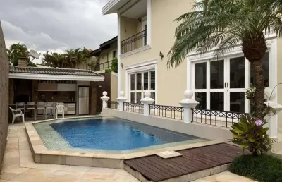 Alphaville 0 - casa com 582m², 4 suítes, 9 vagas, piscina, espaço gourmet em bar